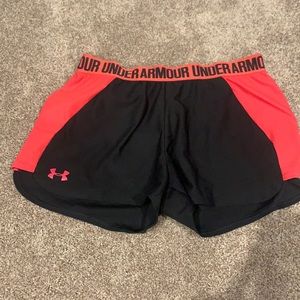Black and pink Under Armour athletic shorts.